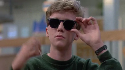 HD PC desktop wallpaper featuring Anthony Michael Hall as Brian Ralph Johnson from the movie The Breakfast Club, wearing sunglasses and a green sweater.