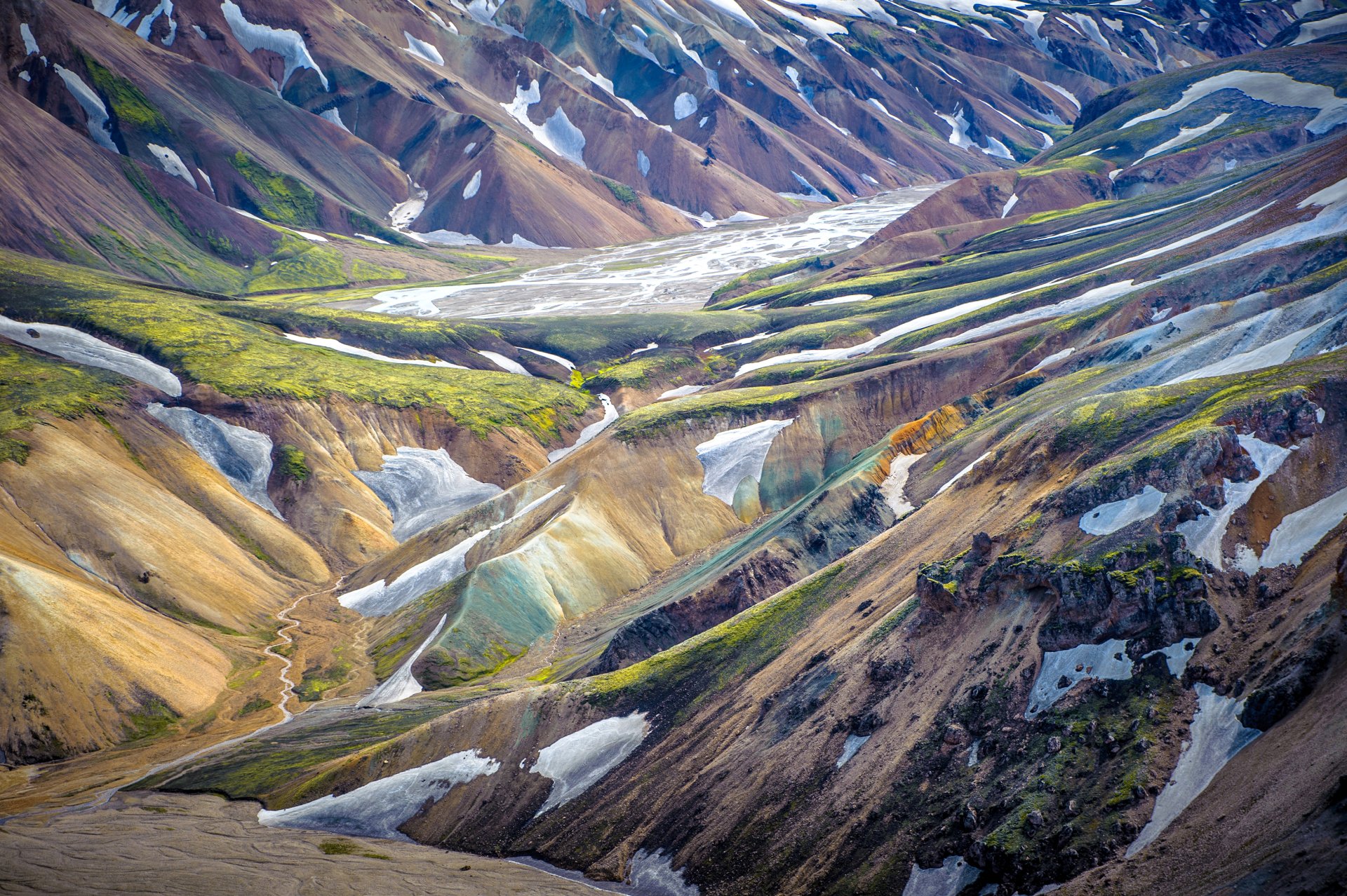 Colorful Icelandic rhyolite mountains and braided glacial valleys in a vivid nature landscape — 2K Quad HD PC desktop wallpaper/background.