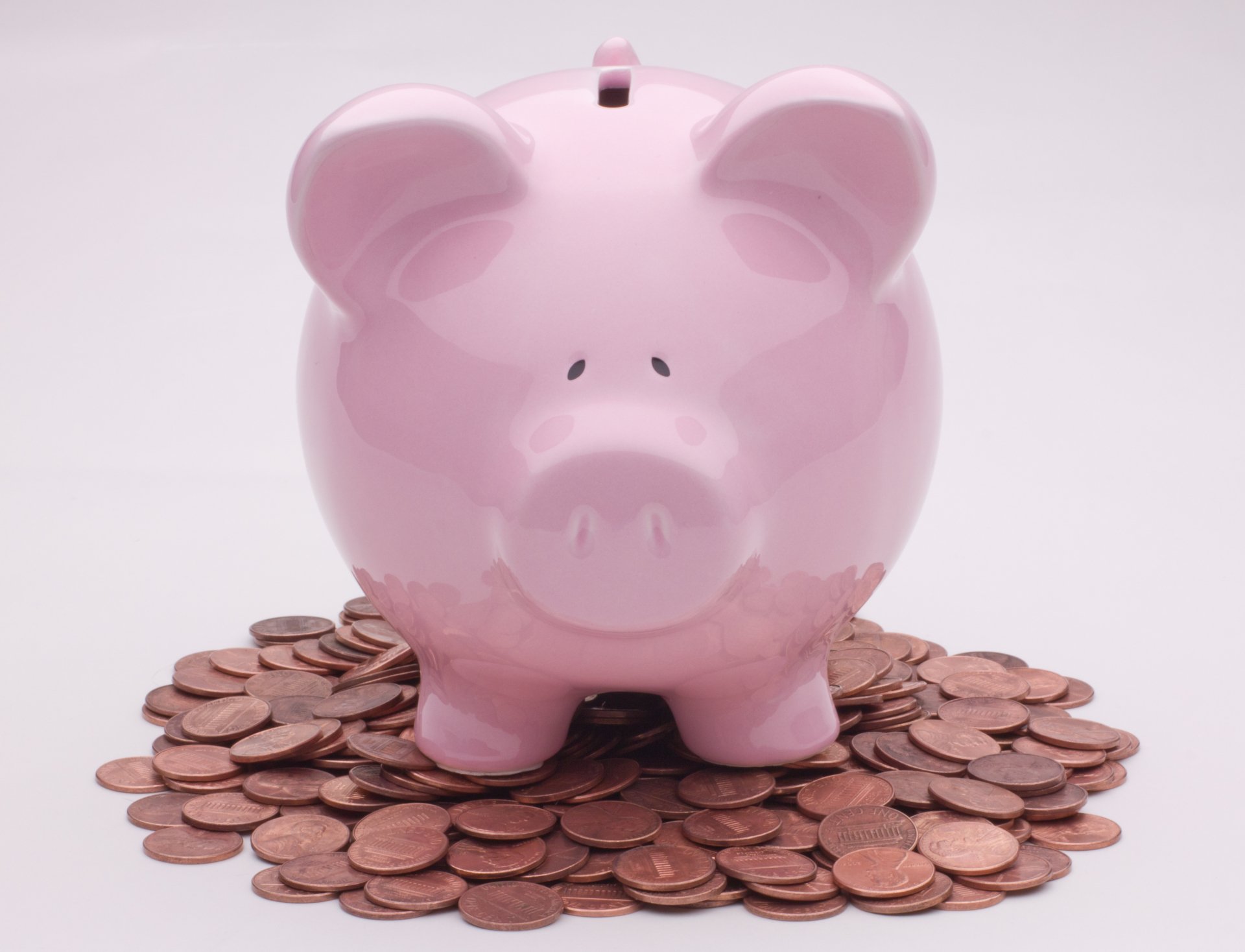 4K Ultra HD PC desktop wallpaper of a pink piggy bank atop a pile of coins — money, coin, man-made object on a white background.