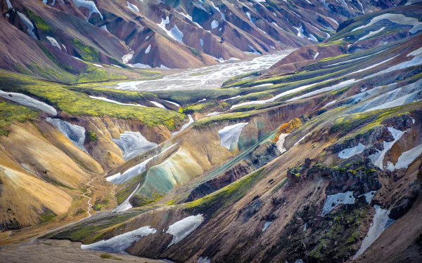 Colorful Icelandic rhyolite mountains and braided glacial valleys in a vivid nature landscape — 2K Quad HD PC desktop wallpaper/background.