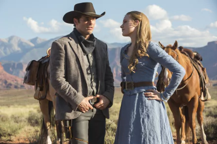 A scene from the TV show Westworld featuring Teddy Flood, played by James Marsden, and Dolores Abernathy, portrayed by Evan Rachel Wood, set against a stunning western landscape.