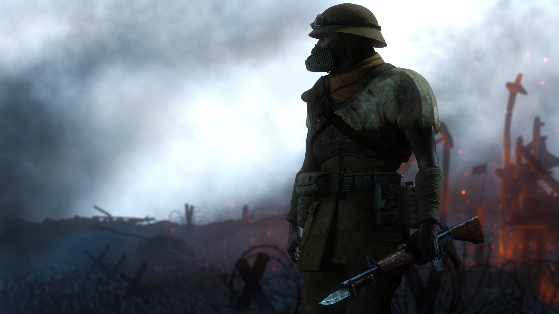 2K Quad HD PC desktop wallpaper and background — a sci‑fi soldier in helmet and gas mask stands on a smoky, embers-lit battlefield, gripping a futuristic bayonet.