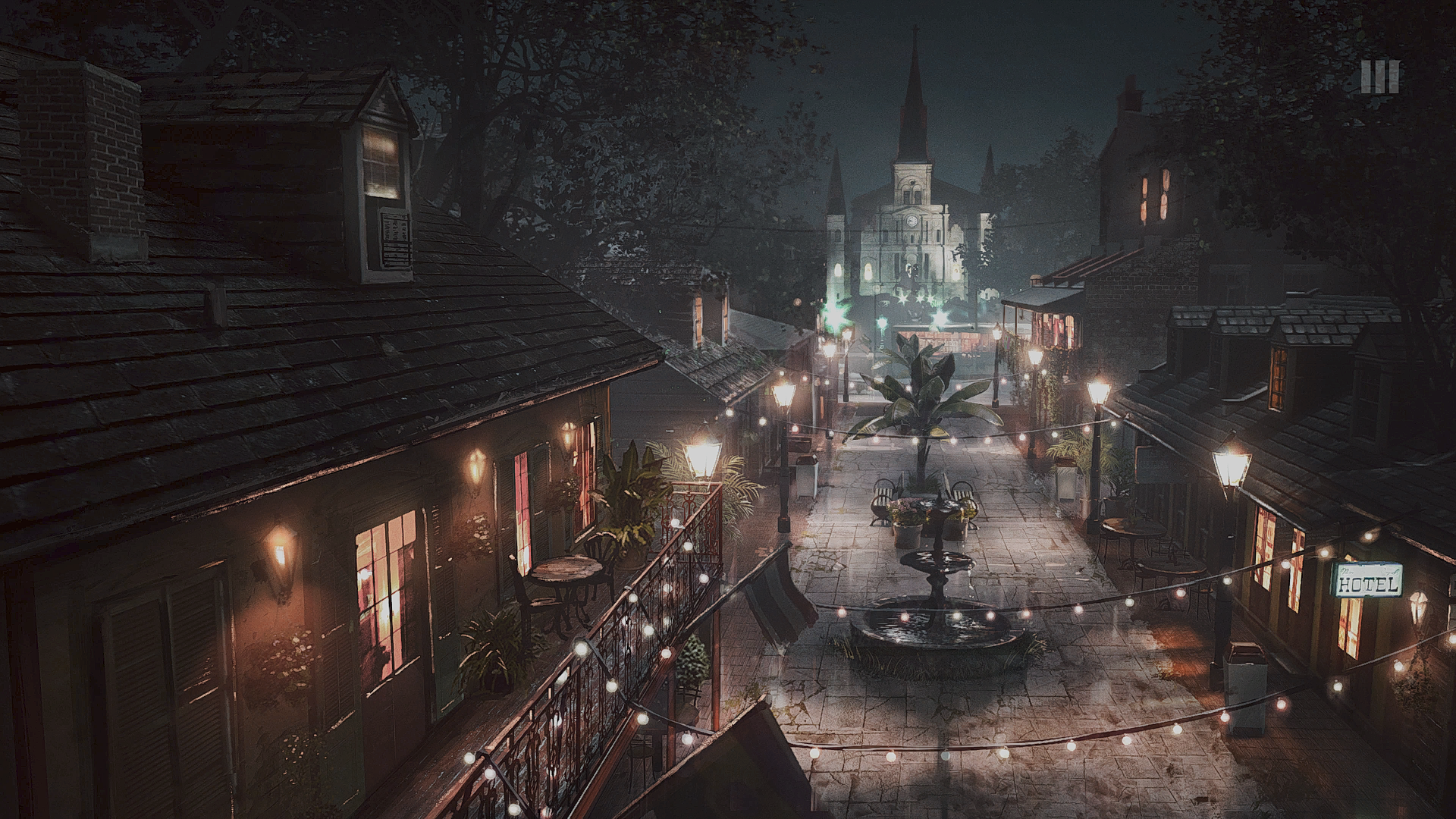 Mafia III video game HD PC desktop wallpaper and background: moody nighttime New Bordeaux street scene with balconies, string lights, central fountain and distant cathedral.