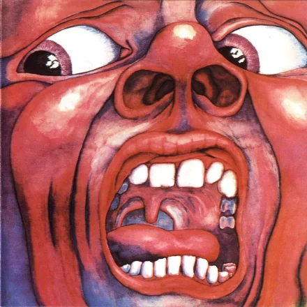 HD PC desktop wallpaper featuring the iconic surreal artwork from King Crimson's music, showcasing a distorted screaming face with vivid colors and intense expression.