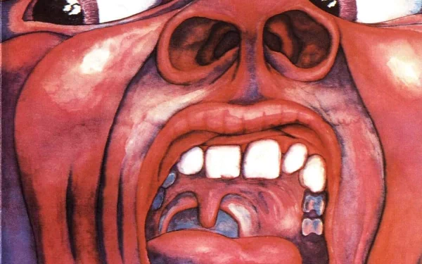 HD PC desktop wallpaper featuring the iconic surreal artwork from King Crimson's music, showcasing a distorted screaming face with vivid colors and intense expression.