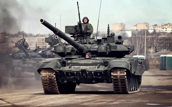 HD desktop wallpaper featuring a T-90 military tank moving on a paved road with a cityscape in the background and smoke rising nearby.