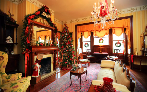 Cozy living room decorated with furniture, a Christmas tree, wreaths, and holiday accents, captured in 4K Ultra HD as a PC desktop wallpaper and background.