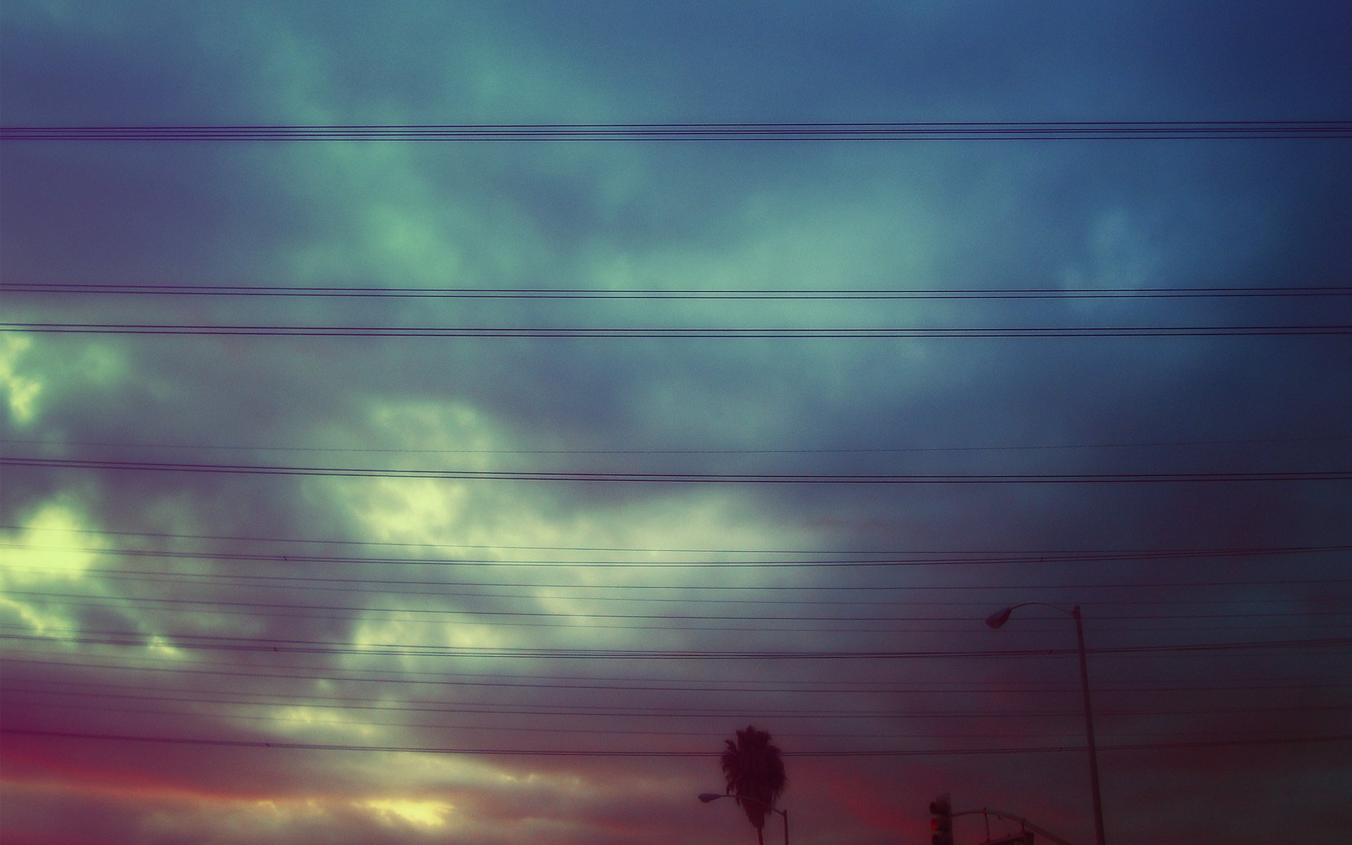 HD PC desktop wallpaper/background showing man-made power lines silhouetted against a moody, colorful dusk sky.