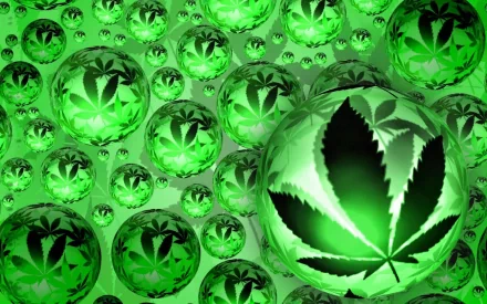 Artistic HD PC desktop wallpaper featuring multiple green spheres with marijuana leaf patterns, creating a vibrant and immersive visual effect.