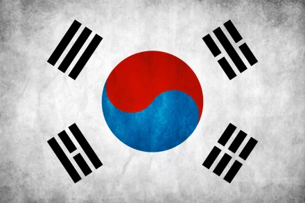 A high-definition desktop wallpaper featuring the flag of South Korea, showcasing the iconic yin-yang symbol in red and blue, surrounded by black trigrams on a textured background.