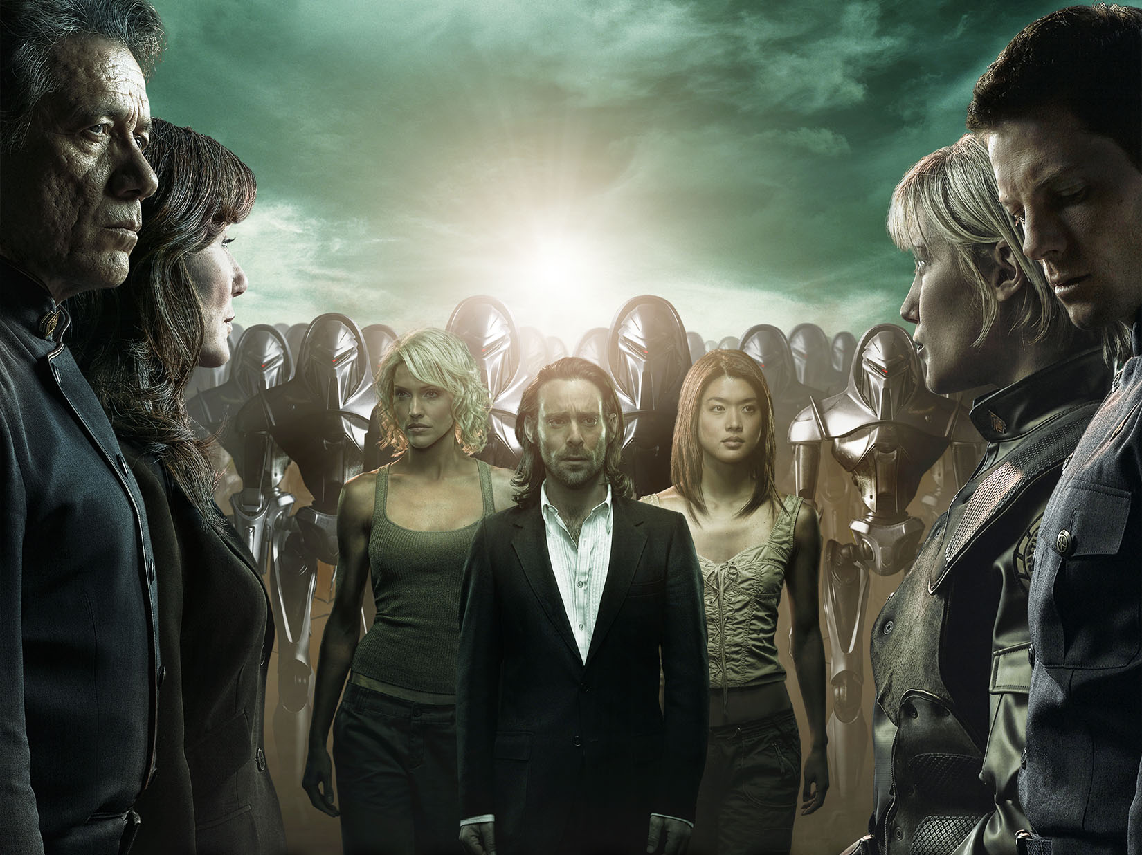 Group portrait of Battlestar Galactica characters, including Number Six, Adama, Thrace, Roslin, Baltar, Lee, and Boomer.