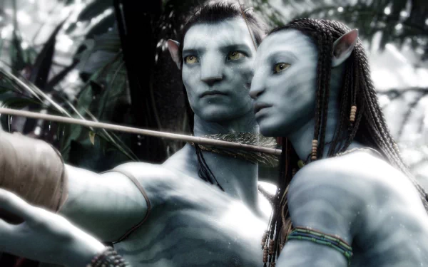 HD PC desktop wallpaper featuring Neytiri and Jake Sully from the movie Avatar in a forest setting, showcasing the film's iconic blue-skinned characters.