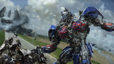 Optimus Prime from Transformers: Age of Extinction stands in an action-packed scene, showcasing his detailed design against a dramatic background of clouds and a war-torn landscape.