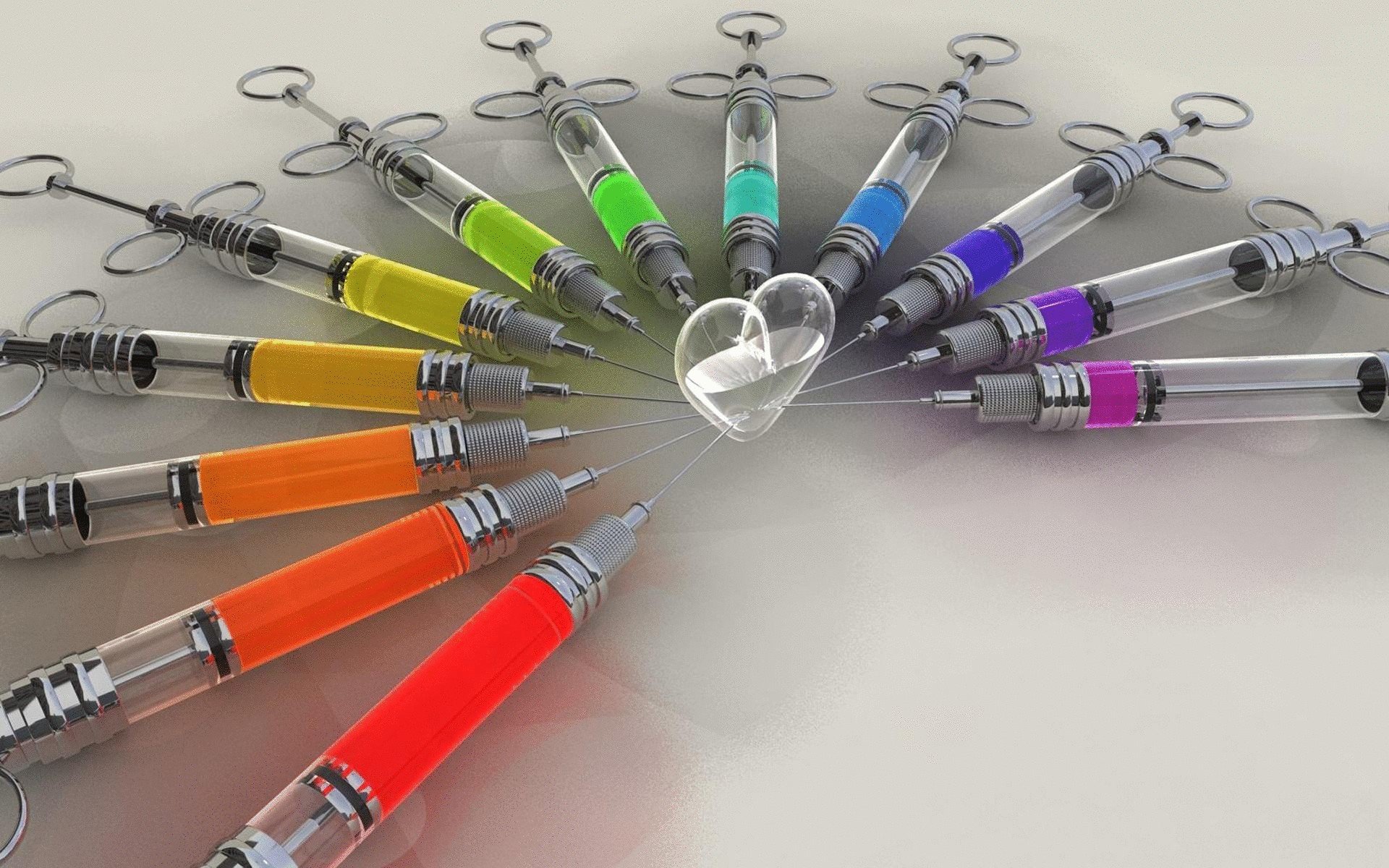 Vibrant syringes in a circular arrangement surround a transparent heart, showcasing artistic flair. This HD wallpaper by Cheyenne Oliger adds a striking visual element to any background.