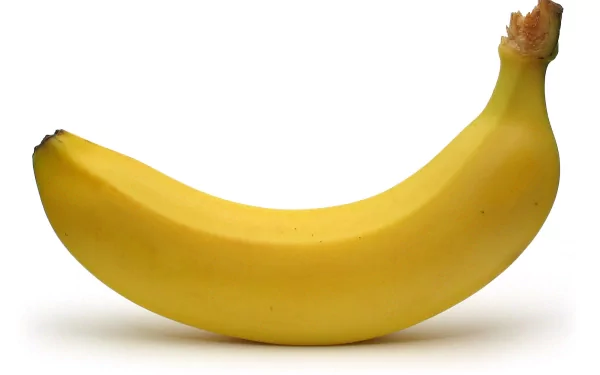 HD desktop wallpaper featuring a vibrant yellow banana on a clean white background, highlighting the fruit’s smooth texture and natural curve.