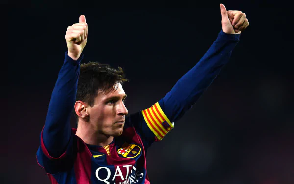 HD desktop wallpaper featuring a soccer player in a Barcelona kit giving a thumbs-up gesture during a night match.