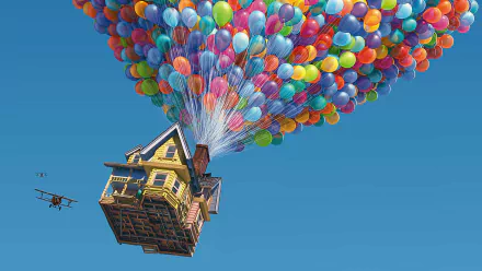 HD desktop wallpaper featuring a scene from the movie Up, showing a house lifted by colorful balloons against a clear blue sky. A small aircraft appears to the left of the floating house.