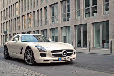 White Mercedes-Benz SLS AMG sports car parked on a city street, showcased as an HD PC desktop wallpaper and background.