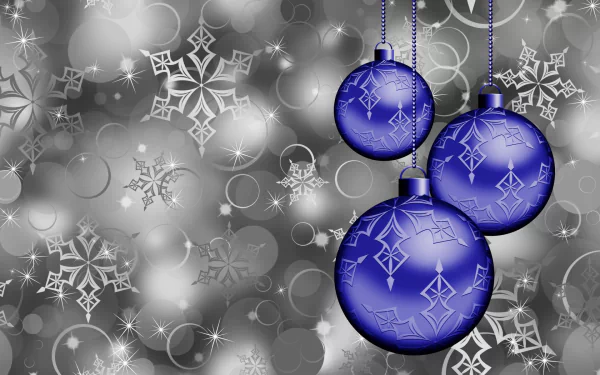 HD desktop wallpaper featuring silver and blue Christmas ornaments with sparkling snowflakes against a shimmering holiday-themed background.