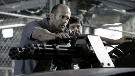 HD desktop wallpaper featuring Jason Statham from the movie Death Race, focusing on an intense action scene with a mounted gun.