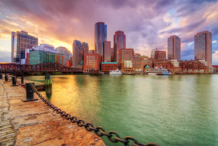 HDR 4K Ultra HD PC desktop wallpaper: Boston, Massachusetts harbor skyline with man-made waterfront, skyscrapers and boats glowing at sunset.