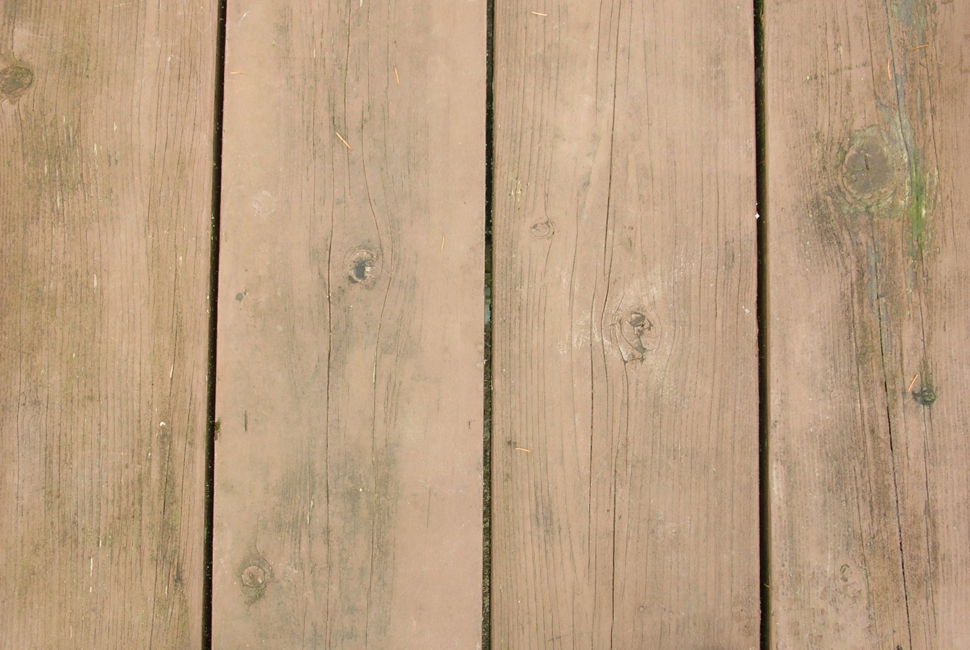 A close-up view of weathered wooden floorboards, showcasing a rich texture and natural tones, suitable as an artistic HD desktop wallpaper and background.