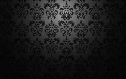 An abstract pattern featuring intricate black designs on a dark background, creating a striking HD wallpaper and desktop background.