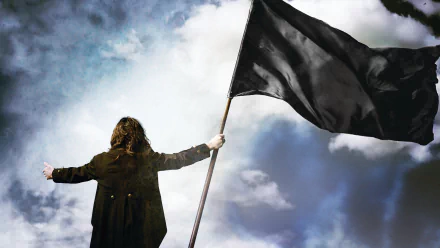 Silhouette of a heavy metal singer holding a black flag against a stormy sky — HD PC desktop wallpaper, music-themed background with a dramatic, dark mood.