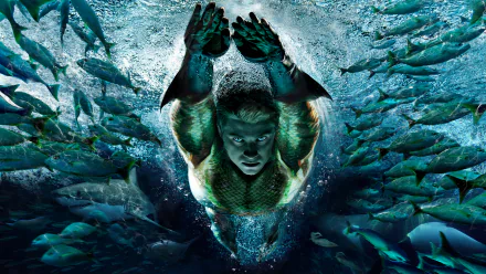 HD desktop wallpaper featuring Aquaman from DC Comics swimming underwater surrounded by fishes.