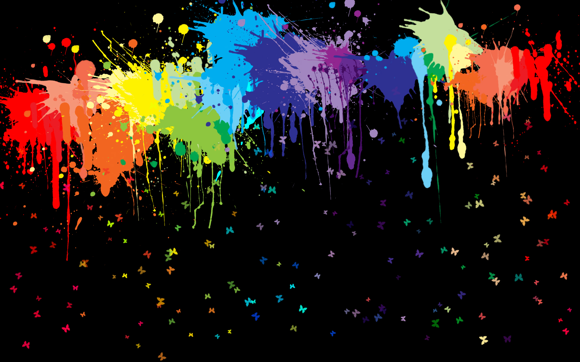 Colorful paint splatters on a HD desktop wallpaper.
