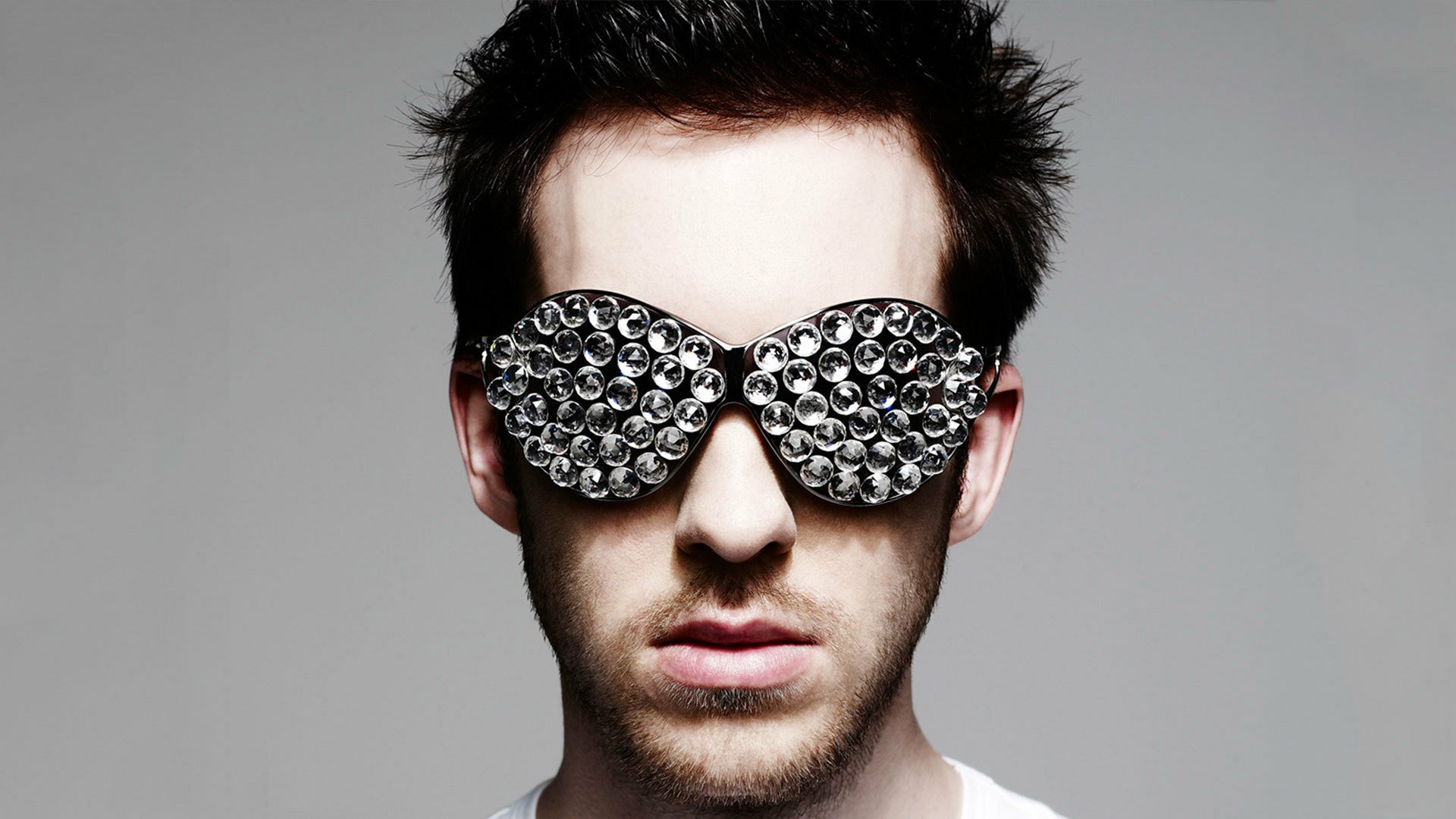 HD wallpaper of a person with stylized sunglasses, providing a creative and modern background.