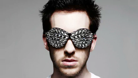 HD wallpaper of a person with stylized sunglasses, providing a creative and modern background.