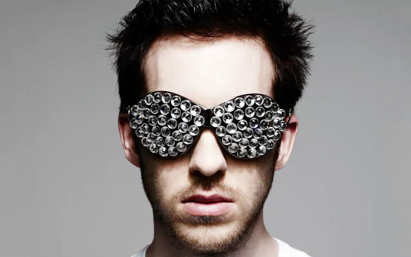 HD wallpaper of a person with stylized sunglasses, providing a creative and modern background.