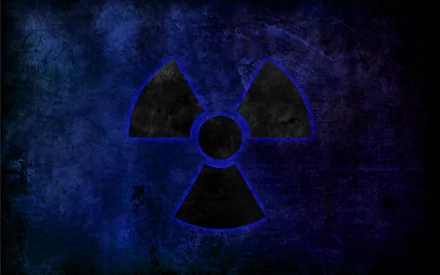 HD PC desktop wallpaper featuring a dark, sci-fi inspired radioactive tri-foil symbol set against a textured blue and black background.