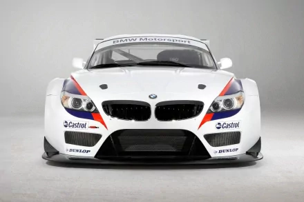 A striking BMW Z4 GT3 showcased front view, featuring its sleek design and motorsport branding, rendered in high definition for a stunning desktop wallpaper.