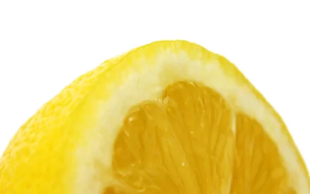 HD desktop wallpaper featuring a close-up of a vibrant yellow lemon against a clean white background.