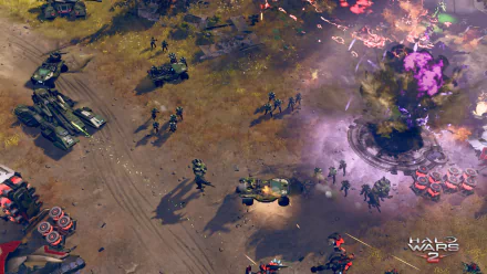 HD desktop wallpaper of a Halo Wars 2 battle scene with vehicles and troops engaged in combat on a rugged terrain.