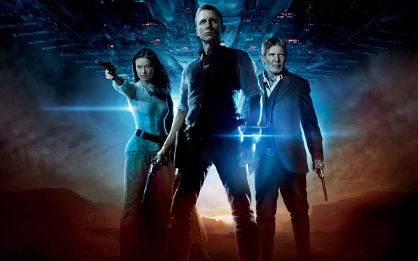 HD PC desktop wallpaper of three lead characters from the movie Cowboys & Aliens — two gunslingers and a woman stand backlit beneath a hovering alien ship.