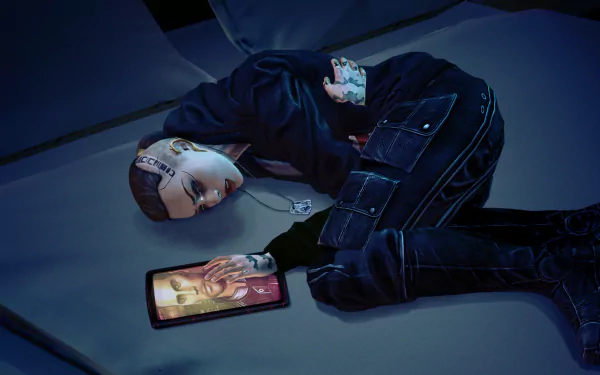 HD PC desktop wallpaper featuring Jack from the video game Mass Effect, depicted lying on the floor with a tablet displaying another character's image.
