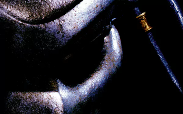 Dark close-up of the Predator mask with textured metal and tubing — Predator 2 movie HD PC desktop wallpaper and background.