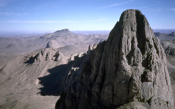 Rugged Assekrem peak in the Hoggar Mountains, Tassili N'Ajjer region of Algeria — desert mountain nature scene, HD PC desktop wallpaper.