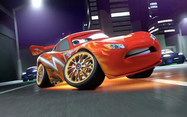 HD PC desktop wallpaper from the movie Cars Toons: Mater's Tall Tales — red flame-decaled racecar speeding through a neon-lit city street.