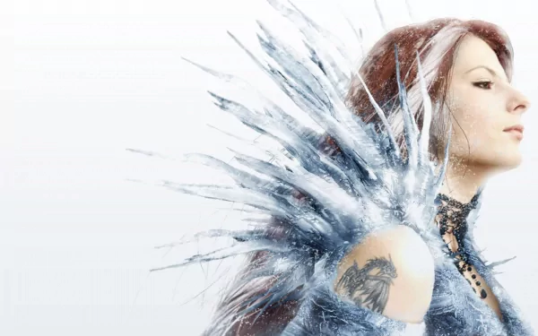 A fantasy-themed HD desktop wallpaper featuring a woman with crystal-like icy elements, adorned with a tattoo, capturing an ethereal essence in white and blue hues.