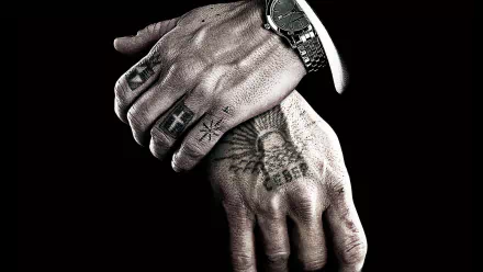 HD PC desktop wallpaper: close-up of tattooed hands with rings and a watch on a black background — from the movie Eastern Promises.