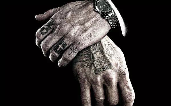 HD PC desktop wallpaper: close-up of tattooed hands with rings and a watch on a black background — from the movie Eastern Promises.