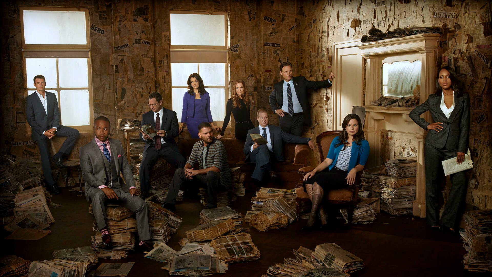 HD PC desktop wallpaper for the TV show Scandal: ensemble cast in a dim, paper-strewn room, promotional TV Show background.