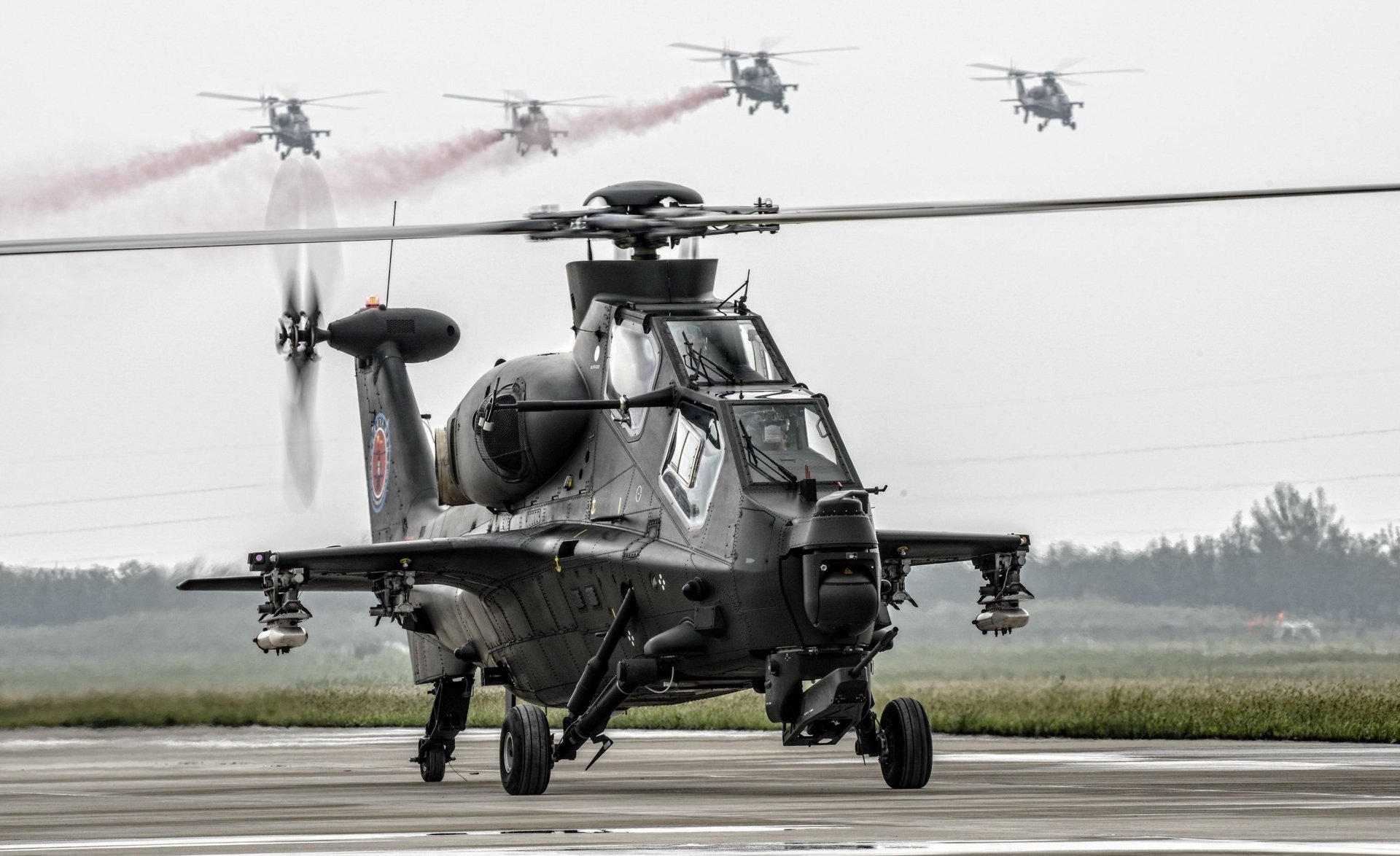 HD desktop wallpaper featuring a CAIC Z-10 military attack helicopter on the ground with several others flying in formation in the background.