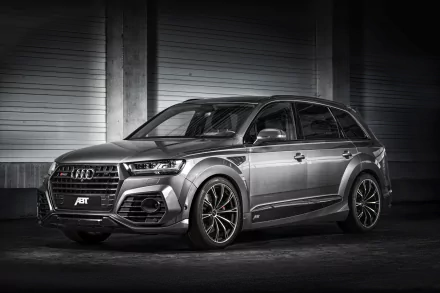 Silver Audi Q7 SUV with sleek design and black rims, showcased as a high-definition PC desktop wallpaper and background.