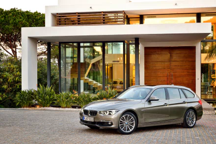 Silver BMW 3 Series parked in front of a modern house, captured in a sharp 4K Ultra HD desktop wallpaper image.