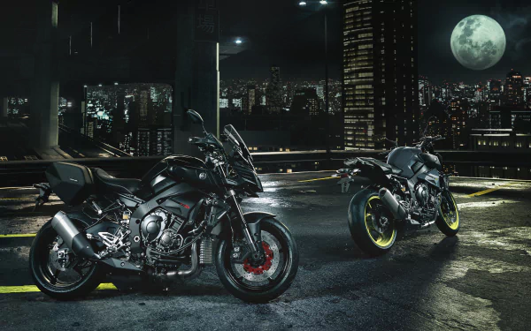 Night 4K Ultra HD desktop wallpaper showing two Yamaha MT-10 motorcycles (vehicles) parked on a rooftop under a full moon with a glowing city skyline.